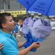Illustration for article titled Why Chinese men keep proposing to auto show models